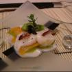 Carpaccio de vieiras,zanahoria babi,trompetas de los muertos,espuma de kiwi y tartufo