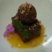 Soletilla de azafran,arroz inflado,esfera de chocolate con almendras y coulis de fruta de la pasion